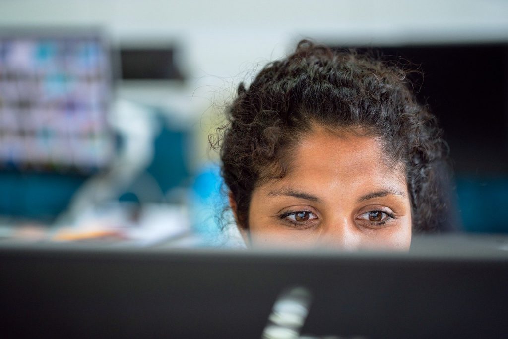 woman working on a computer in an office